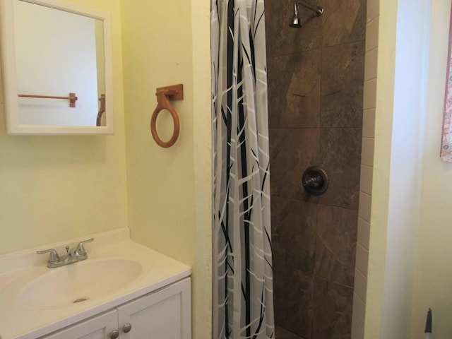 bathroom with curtained shower and sink