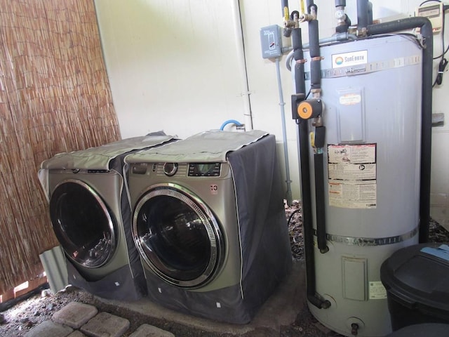 laundry room featuring washer and clothes dryer and gas water heater