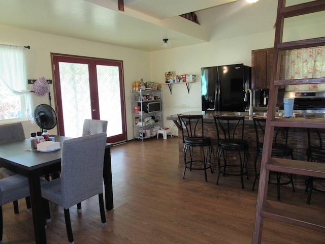 dining area featuring a wealth of natural light, dark wood-type flooring, and sink