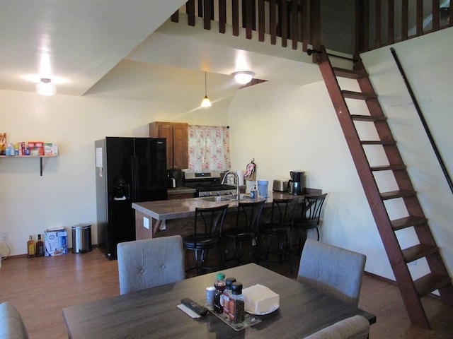 dining area featuring dark hardwood / wood-style flooring and sink