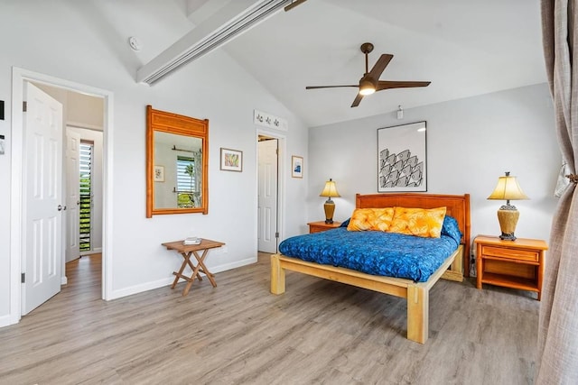 bedroom featuring vaulted ceiling with beams, ceiling fan, and light wood-type flooring