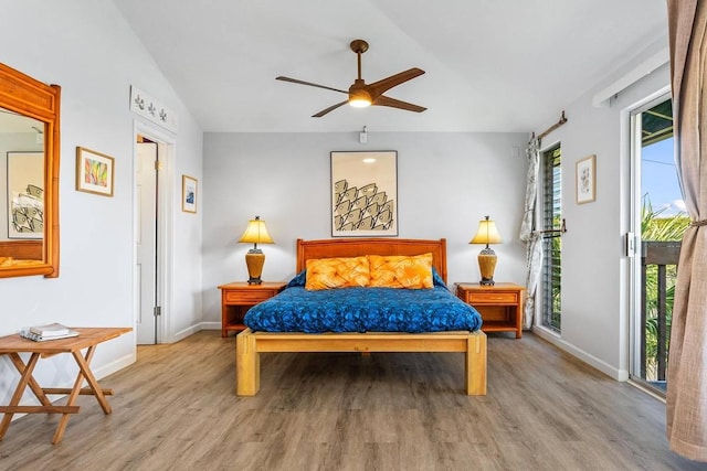 bedroom featuring multiple windows, ceiling fan, and light wood-type flooring