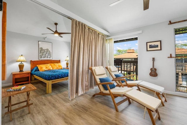 bedroom with ceiling fan, access to exterior, and light hardwood / wood-style flooring