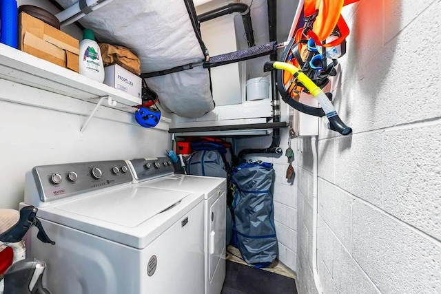 clothes washing area with independent washer and dryer