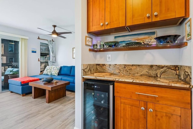 kitchen featuring light hardwood / wood-style floors, wine cooler, and ceiling fan