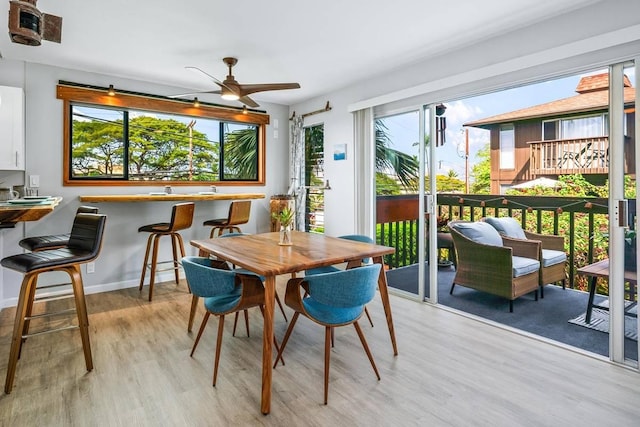 interior space featuring ceiling fan and a wealth of natural light