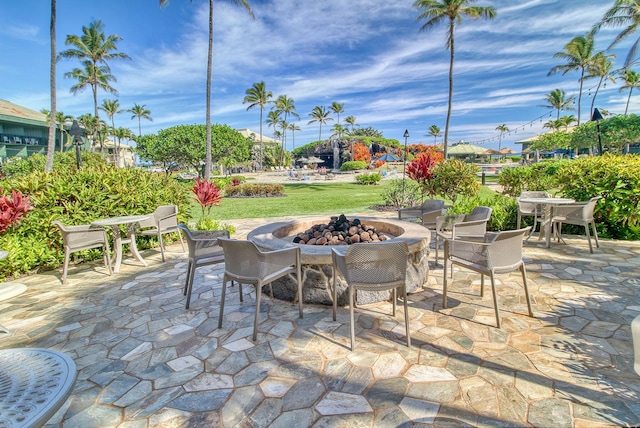 view of patio with a fire pit