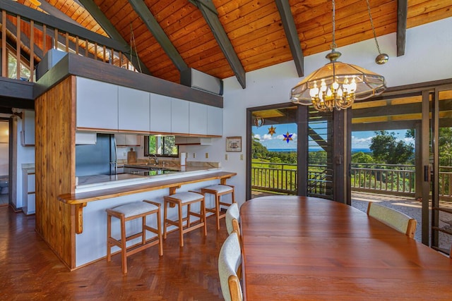 dining room with high vaulted ceiling, dark parquet floors, a notable chandelier, beam ceiling, and wood ceiling