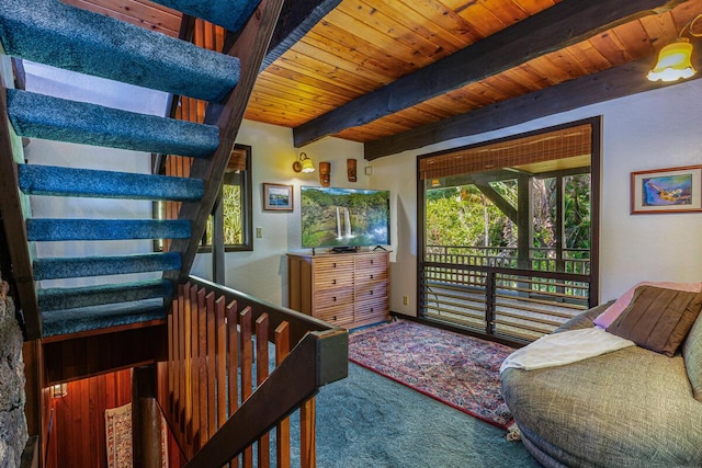 bedroom with carpet, beam ceiling, and wood ceiling