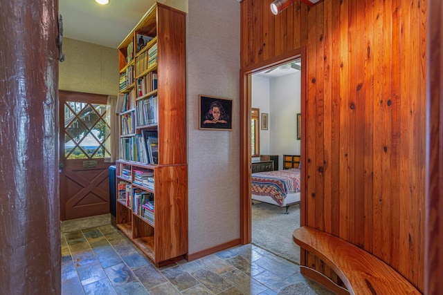 hallway with wooden walls