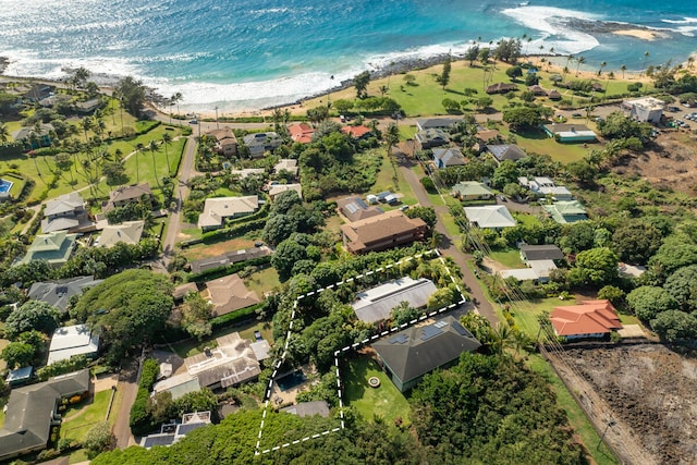 birds eye view of property featuring a water view and a view of the beach