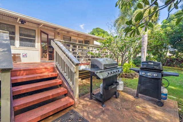 view of patio with a wooden deck and grilling area