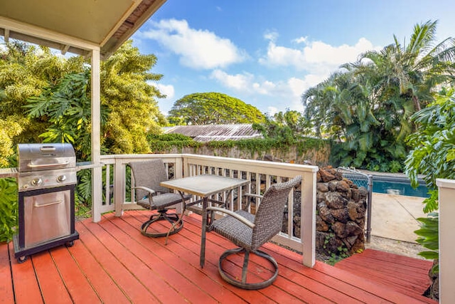 wooden deck with grilling area