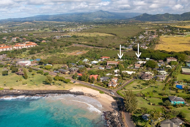 drone / aerial view with a water and mountain view