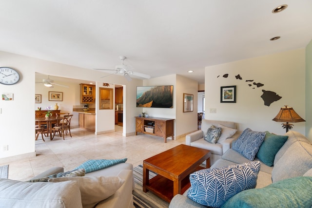 living room with ceiling fan and light tile patterned floors