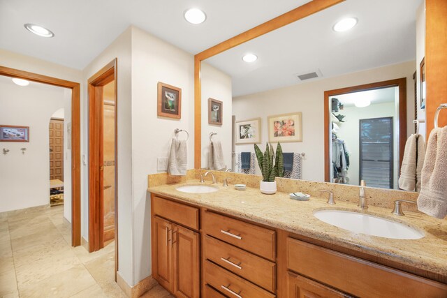 bathroom featuring tile patterned floors and vanity