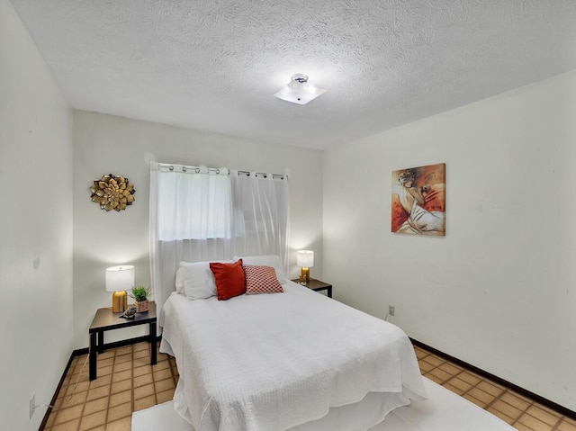 bedroom featuring a textured ceiling