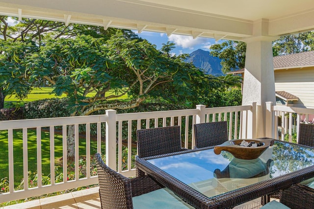 wooden terrace with a mountain view