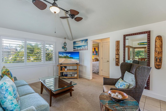 carpeted living room with vaulted ceiling and ceiling fan