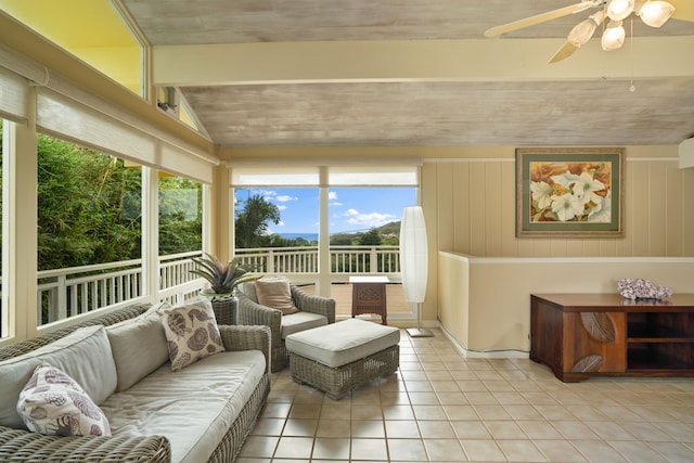 sunroom / solarium featuring ceiling fan and vaulted ceiling