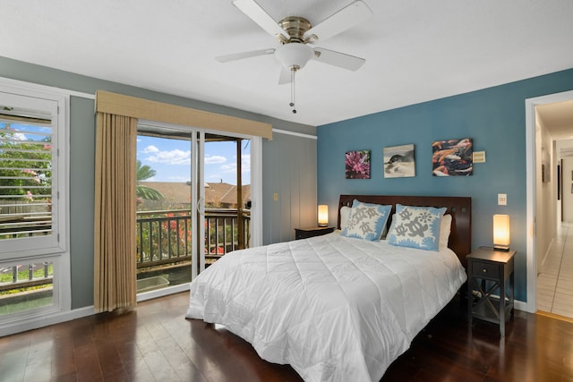 bedroom with access to outside, multiple windows, ceiling fan, and dark wood-type flooring