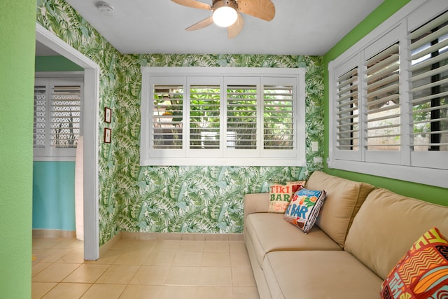 sunroom / solarium with ceiling fan and a healthy amount of sunlight