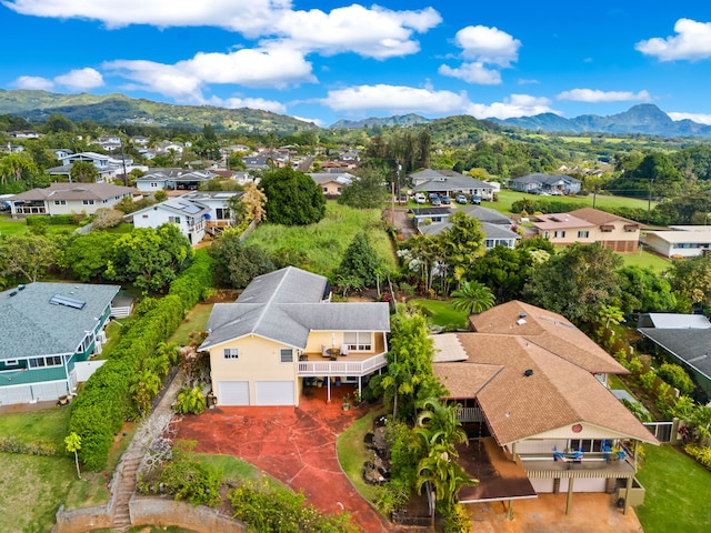 birds eye view of property with a mountain view