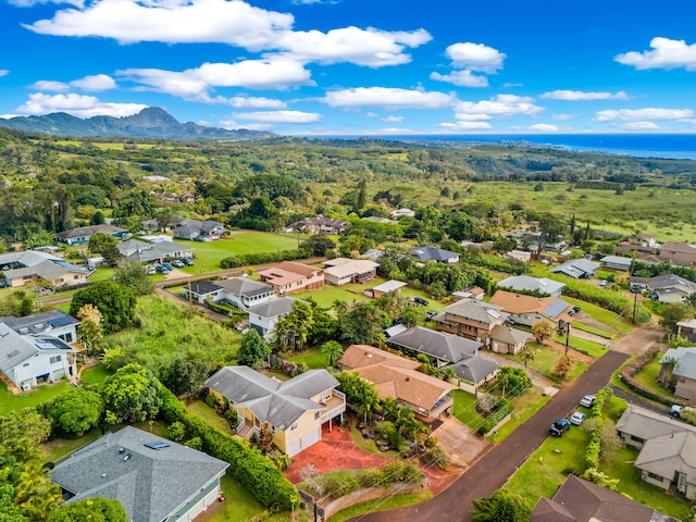 birds eye view of property with a mountain view