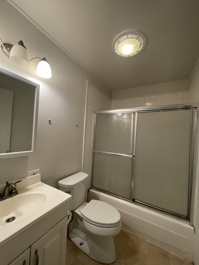 full bathroom with shower / bath combination with glass door, vanity, and toilet