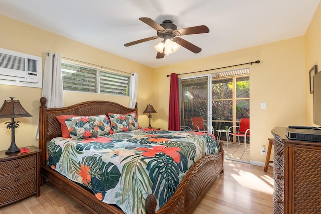 bedroom featuring ceiling fan, light wood-type flooring, access to outside, and a wall mounted AC