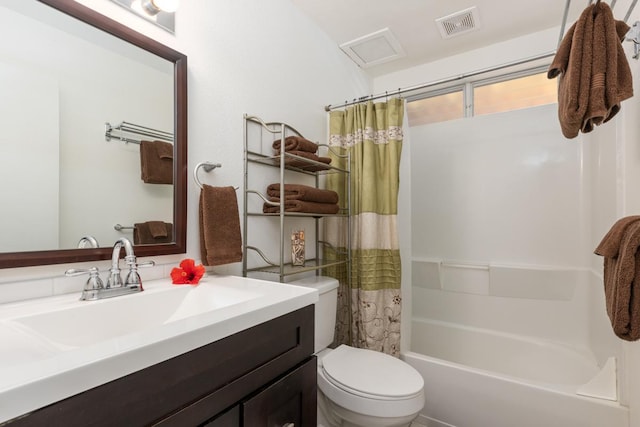 full bathroom with shower / tub combo, vanity, and toilet