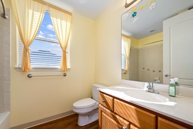 bathroom featuring hardwood / wood-style floors, vanity, and toilet