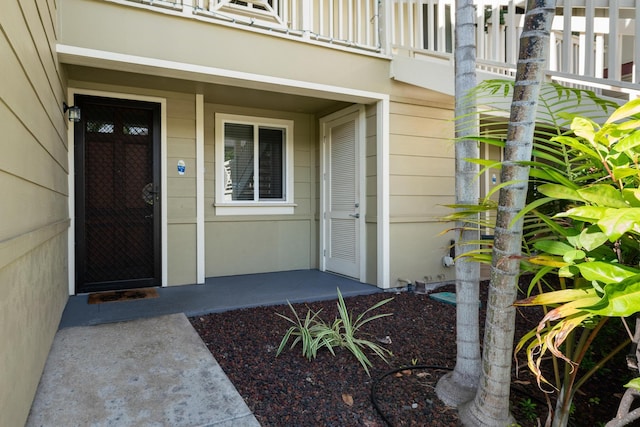 doorway to property featuring a balcony