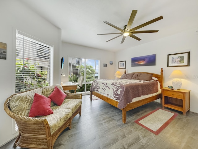 bedroom with hardwood / wood-style flooring, access to exterior, and ceiling fan