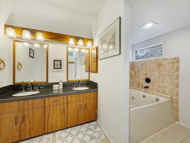 bathroom featuring vanity, tile patterned flooring, and a tub