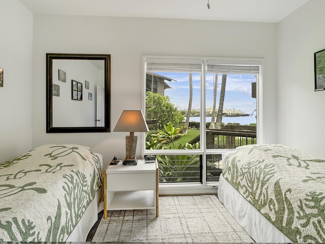 bedroom featuring a water view