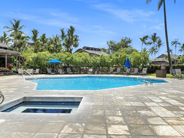 view of pool with a patio area and a community hot tub