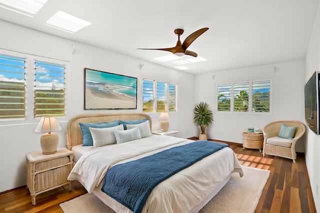 bedroom with ceiling fan and dark wood-type flooring