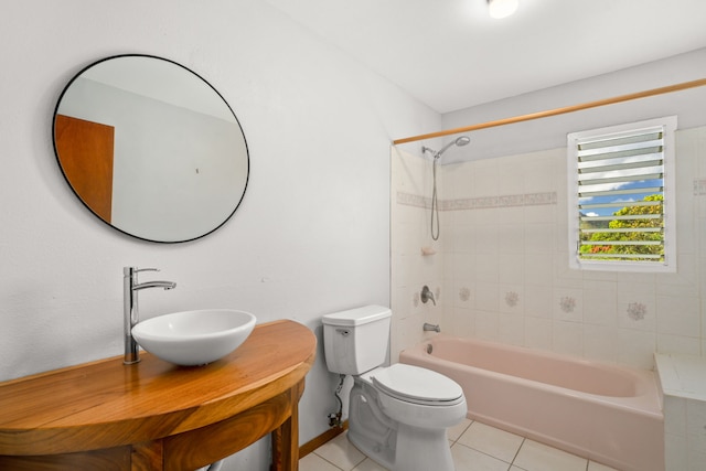 full bathroom with tile patterned floors, tiled shower / bath combo, toilet, and vanity