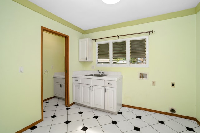 laundry area with washer hookup, electric dryer hookup, cabinets, and sink