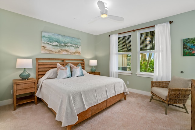 bedroom featuring ceiling fan and light carpet