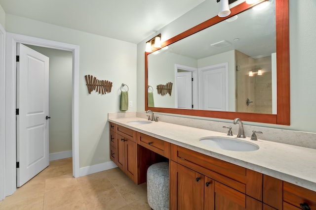 bathroom featuring tile patterned flooring, vanity, and walk in shower