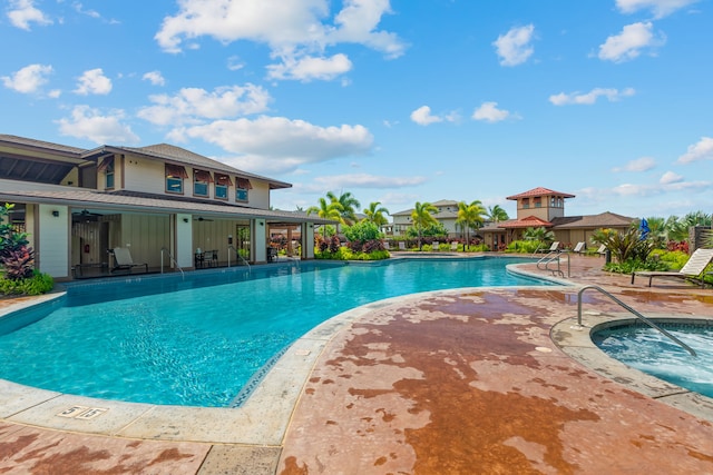 view of pool with a community hot tub and a patio