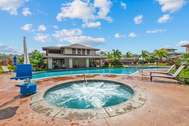 view of swimming pool with a community hot tub and a patio