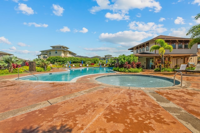 view of swimming pool with a patio