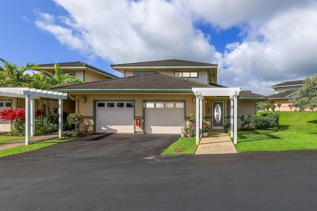 view of front facade featuring a garage and a front yard