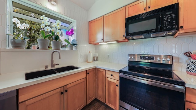 kitchen with stainless steel electric stove, decorative backsplash, and sink