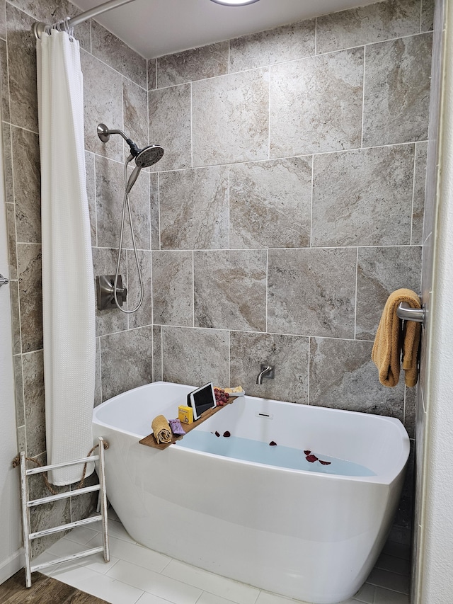 bathroom with separate shower and tub