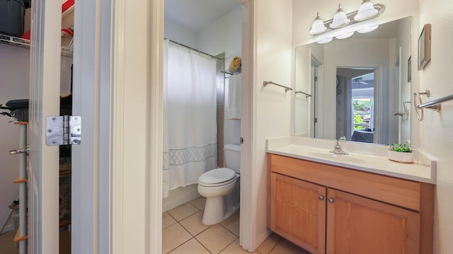 full bathroom with tile patterned flooring, vanity, toilet, and shower / tub combo