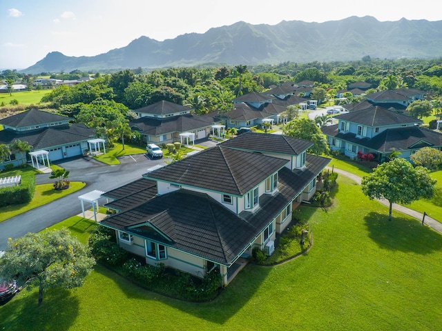 birds eye view of property with a mountain view